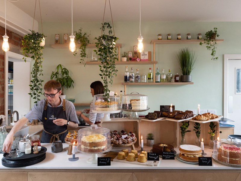 Staff working behind the counter at the Birdhouse Tea Bar & Kitchen.