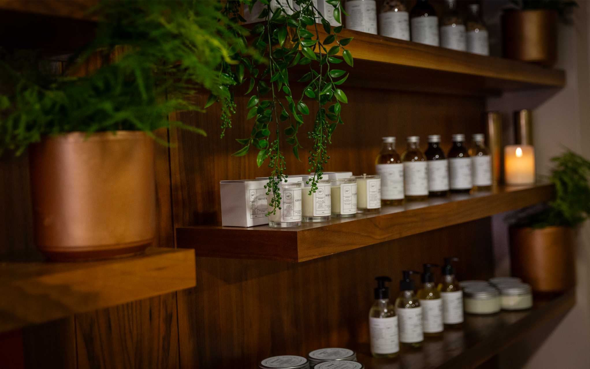 Aromatherapy oils lined up on a shelf  