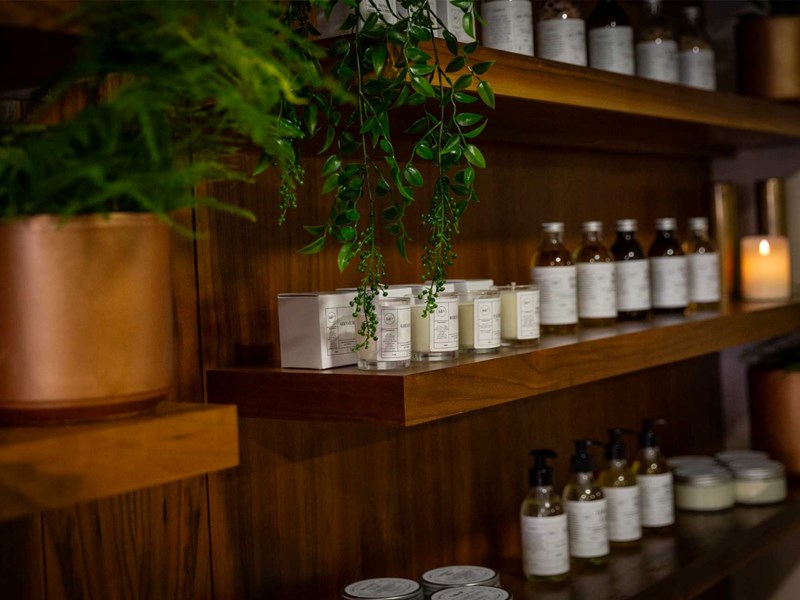 Aromatherapy oils lined up on a shelf
