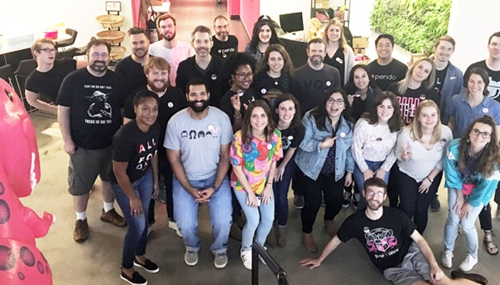 A large group of women and men posing for a photo.