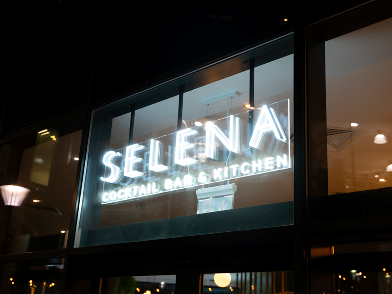 The Selena Bar & Kitchen sign above the entrance.