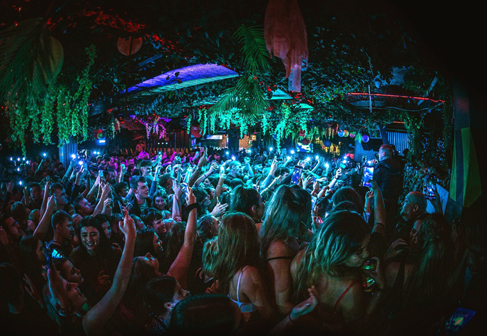 People dancing in a crowded nightclub.