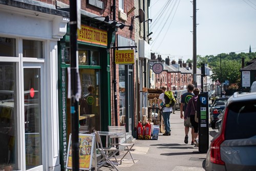 Sharrow Vale Road, in Sheffield, on a sunny day.