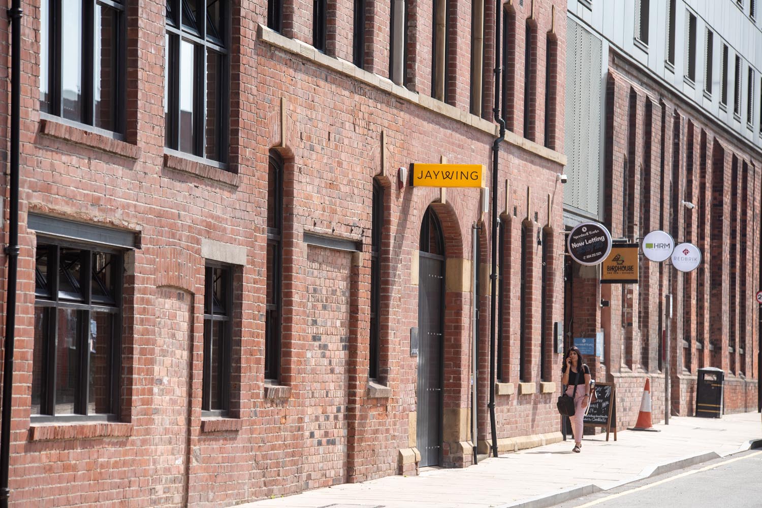 The exterior of a red brick building.