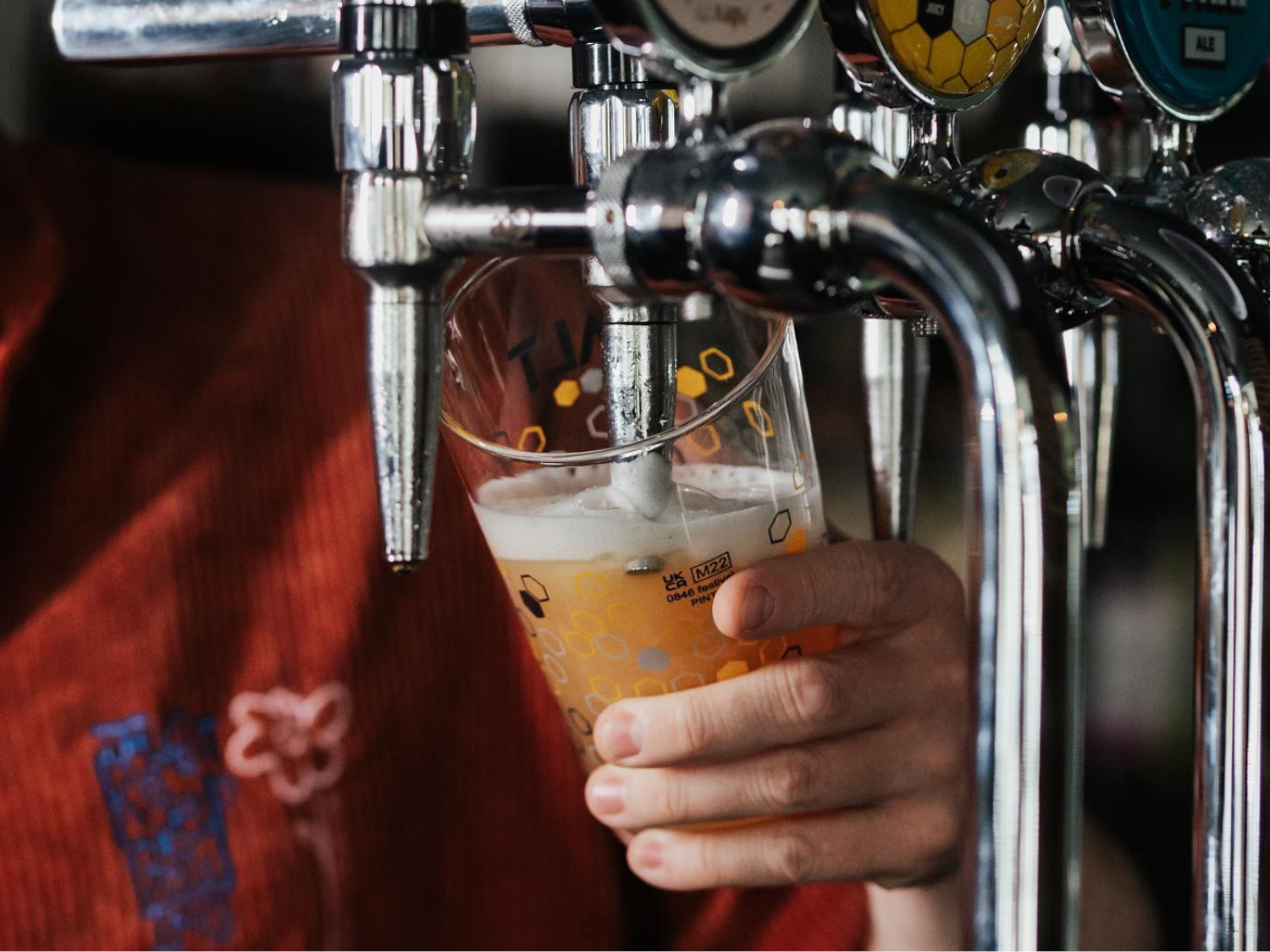 A close-up of a beer being poured at Over The Yardarm