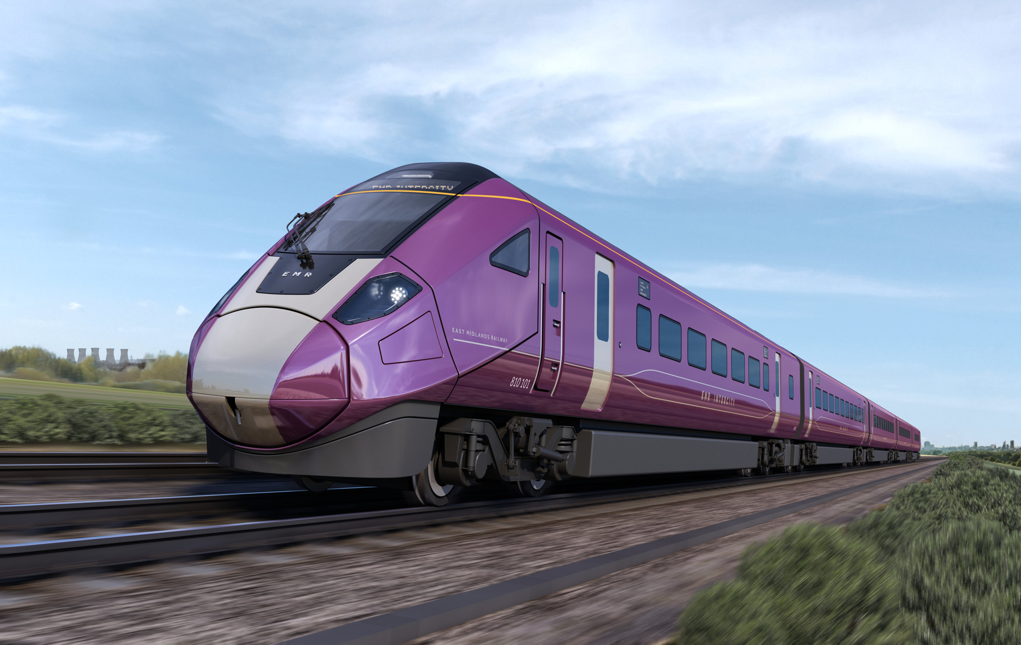 EMR Scenic Cl810 Intercity - Modern high-speed train in a sleek purple and silver design traveling along railway tracks through a green countryside under a clear blue sky. The train has a streamlined front and multiple carriages extending into the distance.