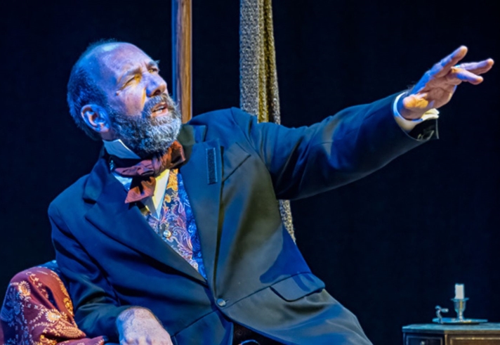 A man performs in period dress.