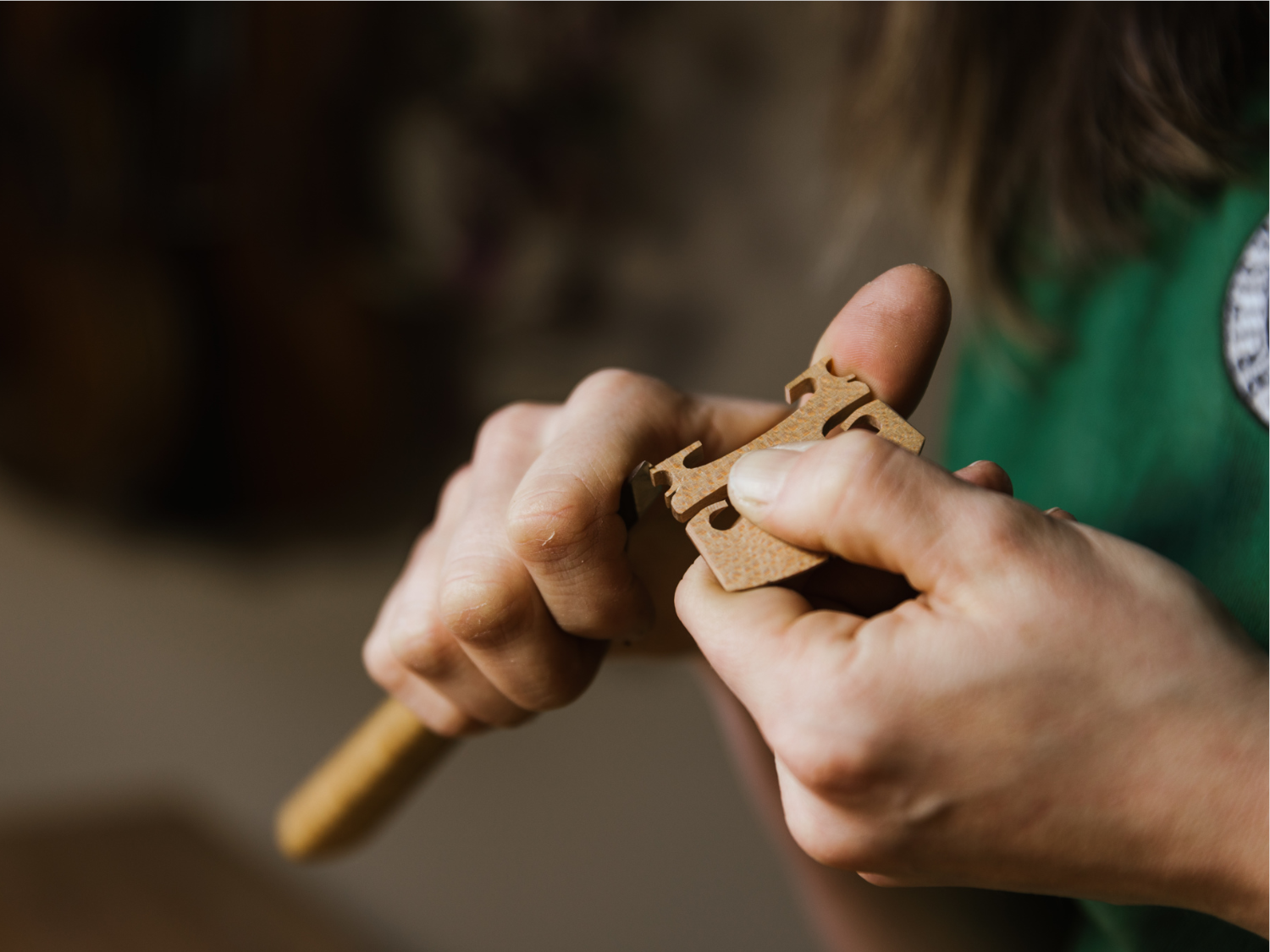 Emma Hardy from Hardy Violins hand-carving the bridge for a violin.