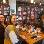 Four people enjoying a night out at Craft & Berry.