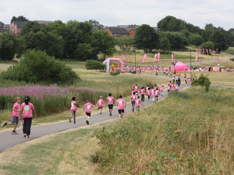 A charity run taking place in Manor Fields Park.