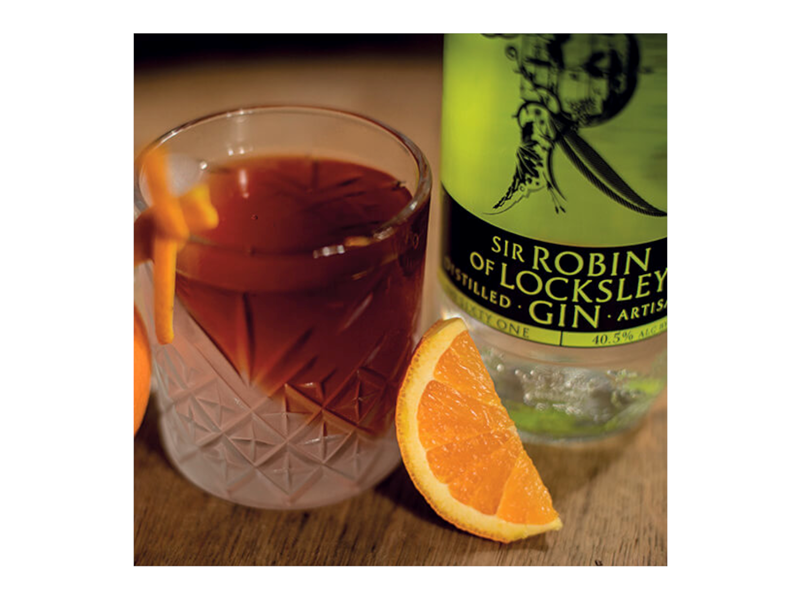 A cocktails and a bottle of Locksley Distilling Co gin.