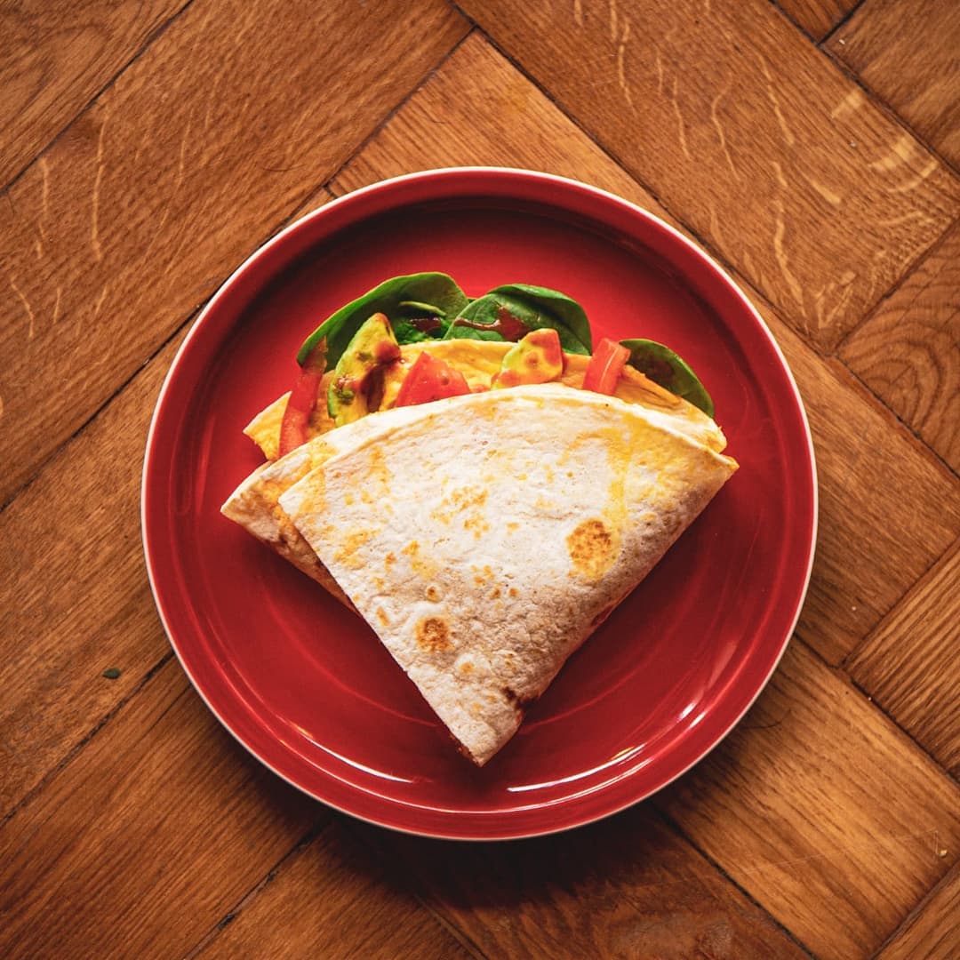 A wrap on a red plate.