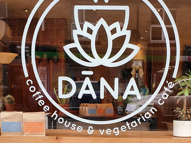 The window, with logo, at the Dana Cafe.