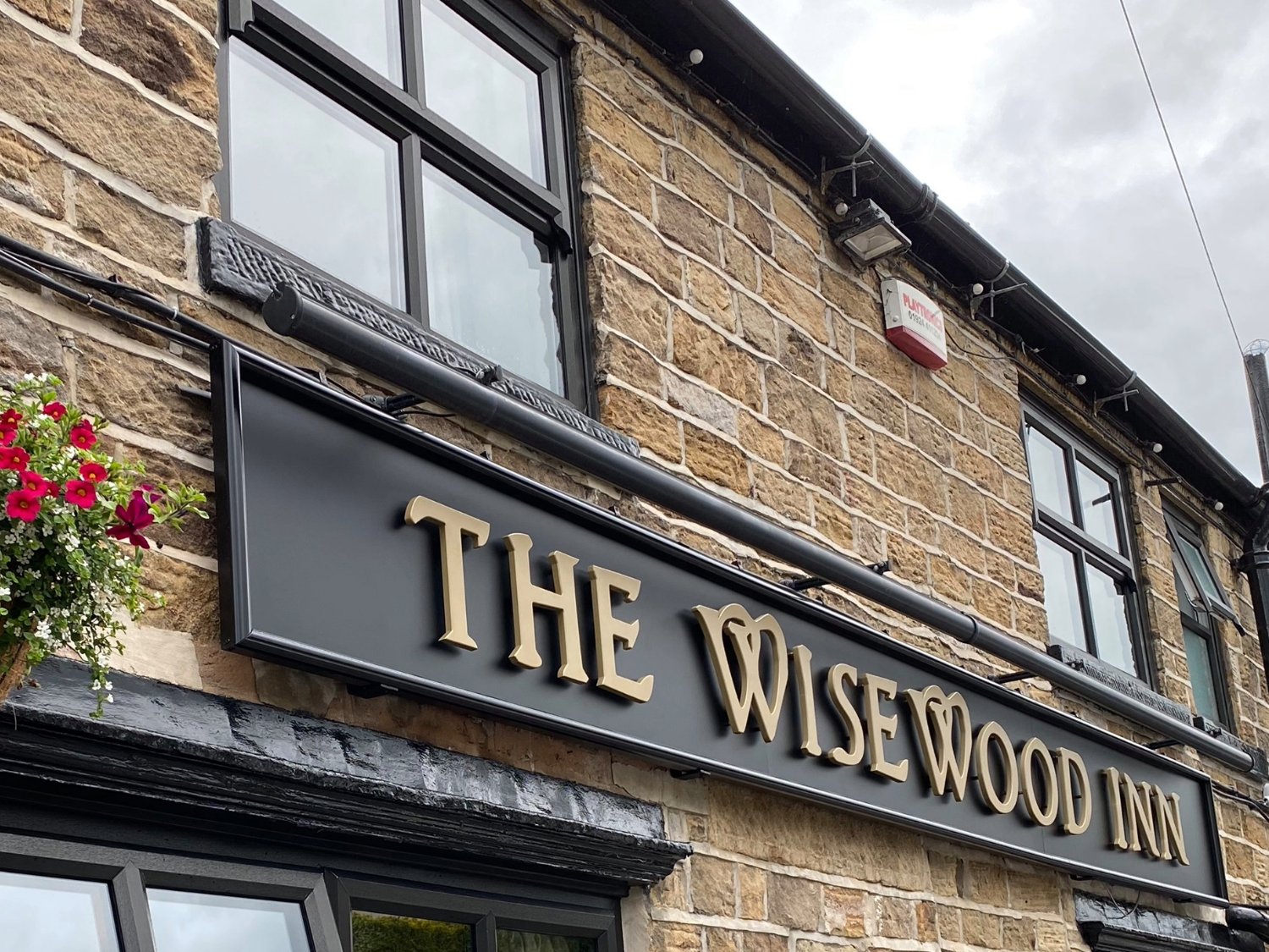 The sign above the door at The Wisewood Inn.