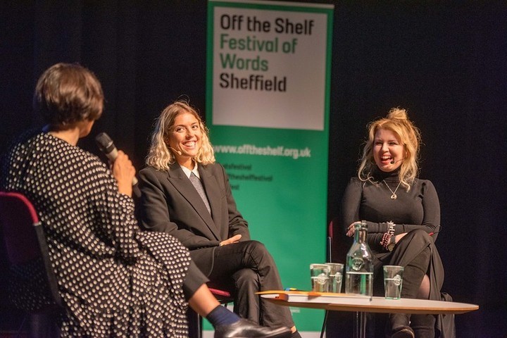 Three people on stage, having an animated discussion as part of the Off The Shelf Festival of Words.