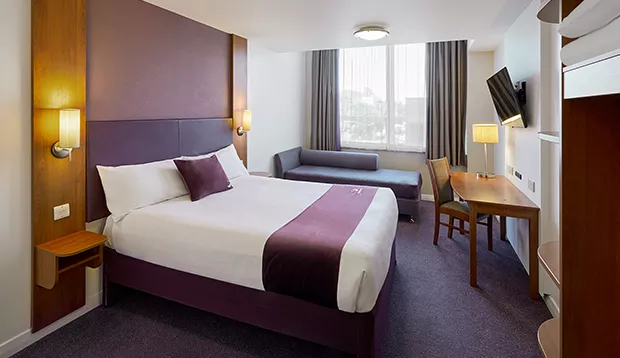 Premier Inn St Mary’s Gate – double room with signature purple decor.
