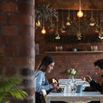 Two people dining at the Birdhouse Tea Bar & Kitchen.