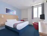 Interior of a double room at Travelodge Sheffield Central with a double bed.