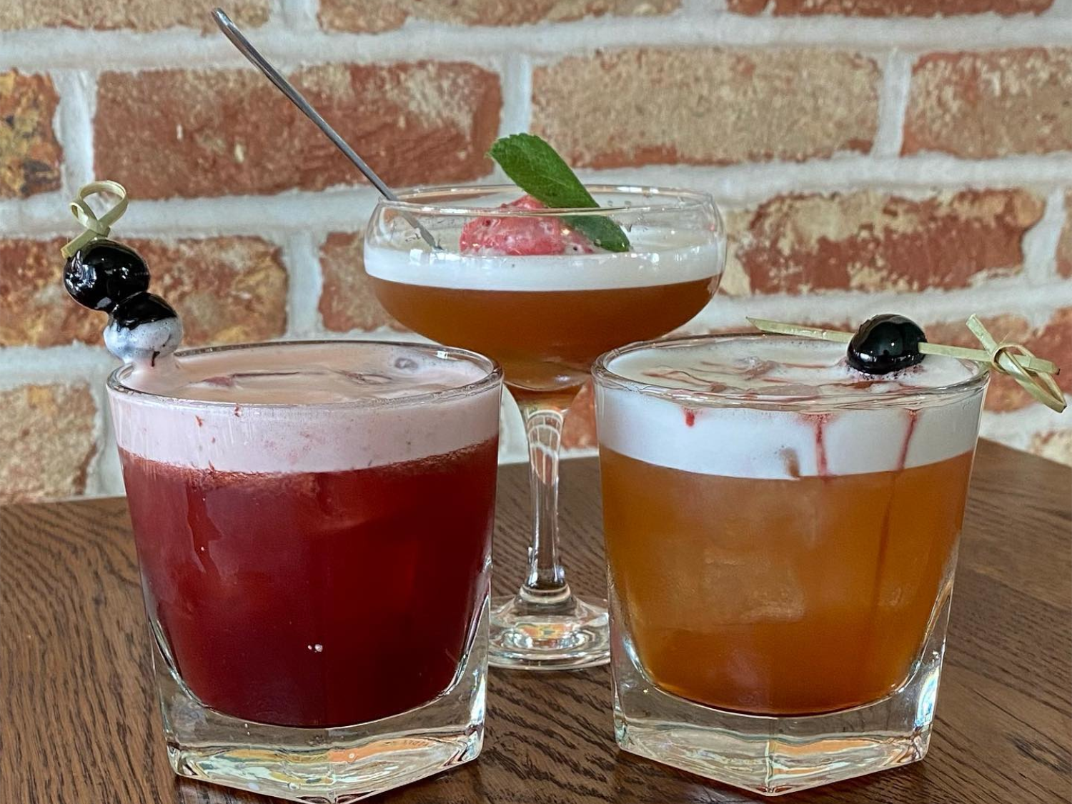 Three cocktails on a table at Over The Yardarm