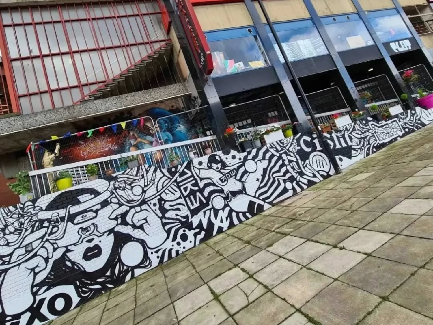 Exterior of Plot 22, which is decorated by several murals.