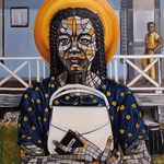 A painting of a woman of African heritage, holding a white handbag to her chest, in front of a pale blue building with a veranda.