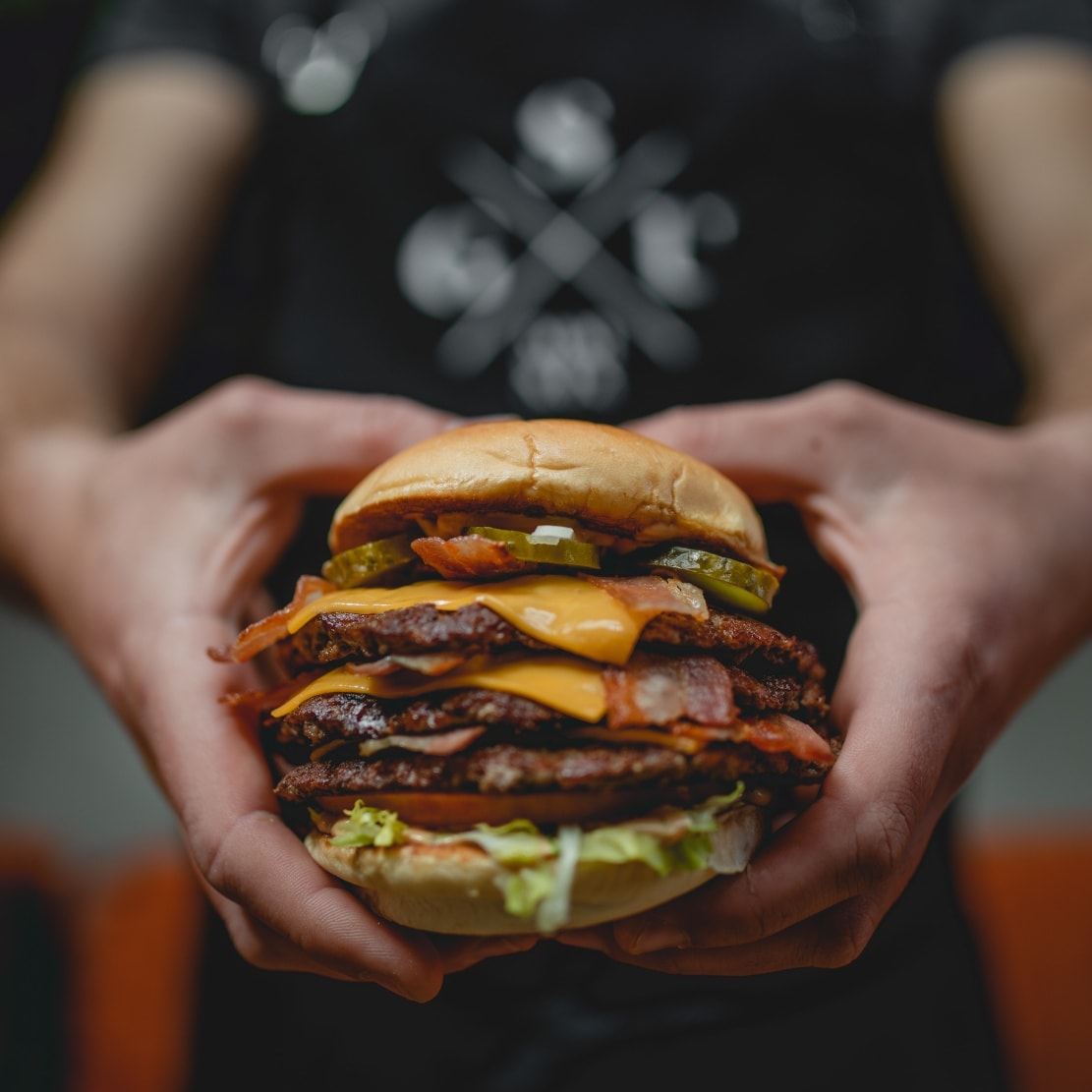 A triple-patty cheeseburger.