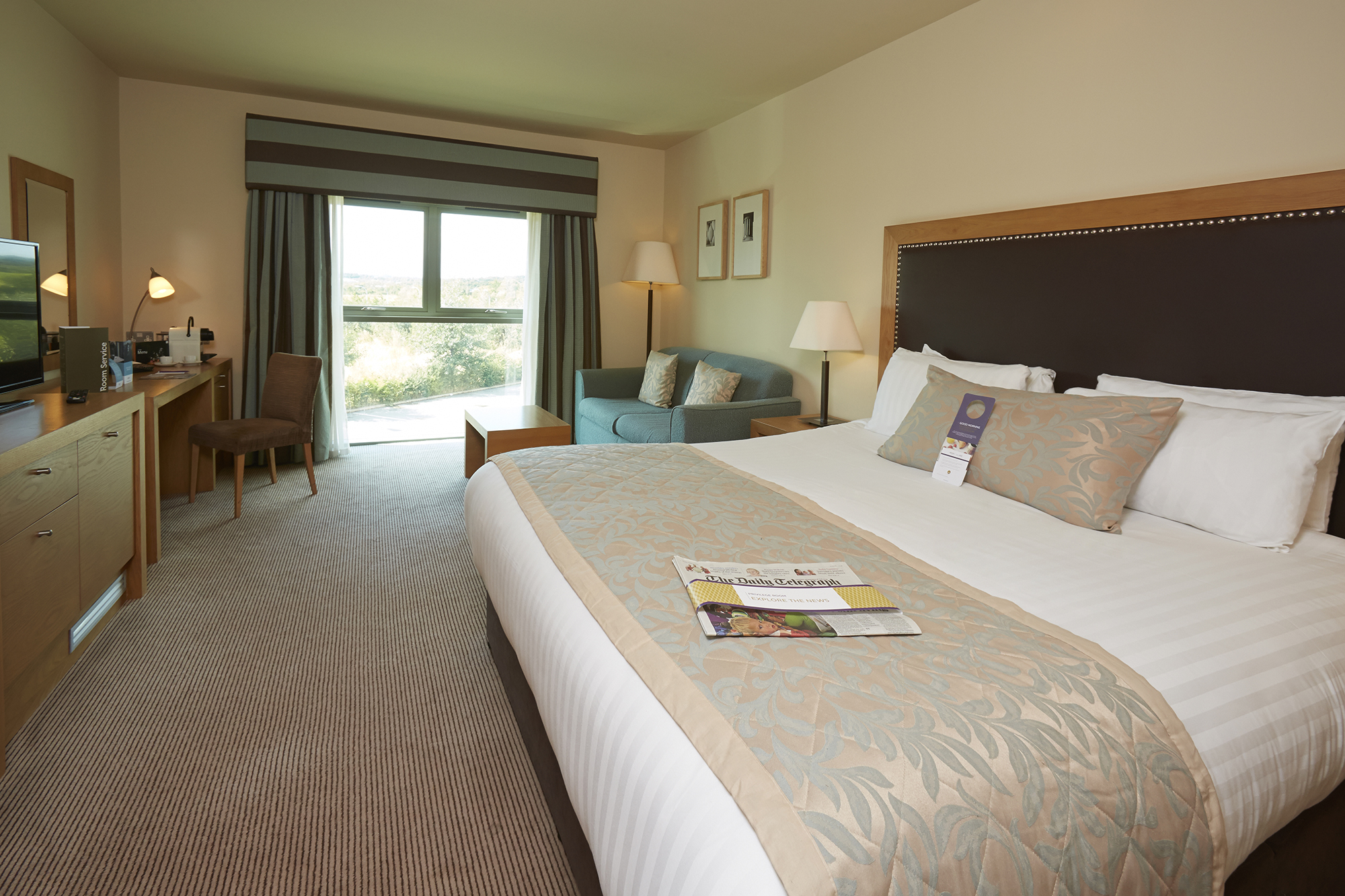 Spacious hotel room featuring a double bed, bedside tables, and contemporary furnishings at Mercure Sheffield Parkway Hotel.”