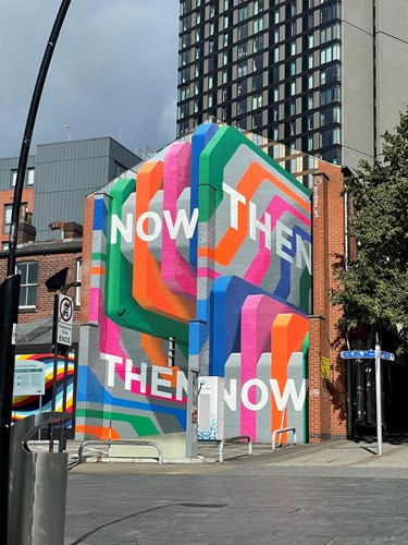Artist Rob Lee's colourful mural Now Then, Then Now visible from Howard Street in Sheffield