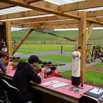 People firing rifles at targets.