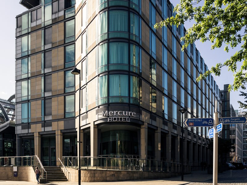 The corner exterior of the Mercure St Paul's Hotel on a sunny day