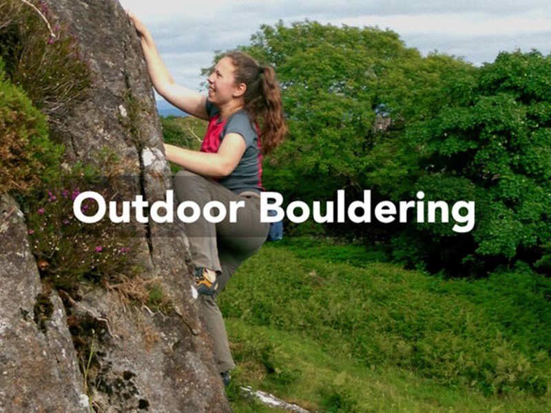 A woman bouldering in the countryside. Over the image are the words 'Outdoor Bouldering'.