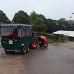 A tractor pulling a small carriage at Whirlow Hall Farm.