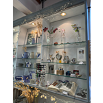 Shelving filled with home wares for sale at All Good Stuff.