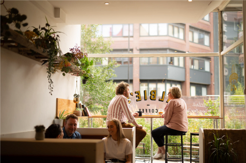 People sat inside Albie's Coffee.