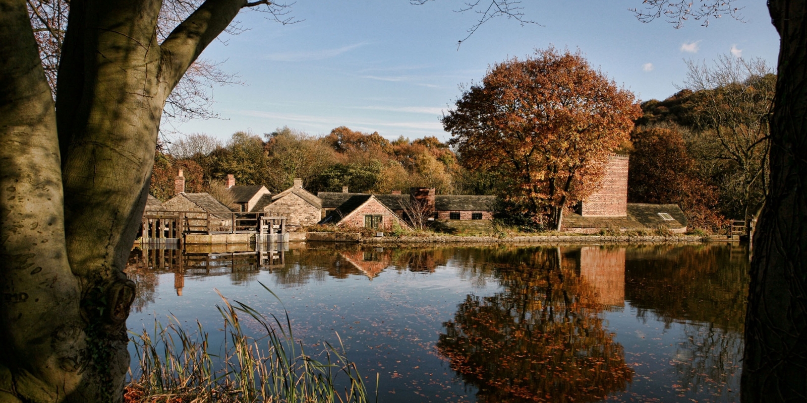 A view of Abbeydale Hamlet across a pond.