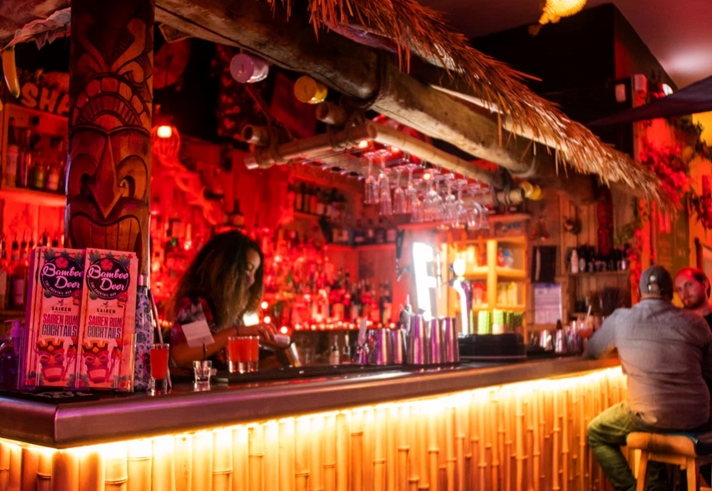 The bar, decorated in a Tiki style, at the Bamboo Door.