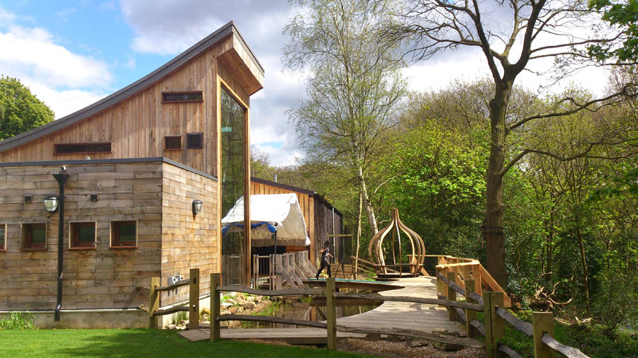 Stone and wood buildings at the J.G. Graves Woodland Discovery Centre.