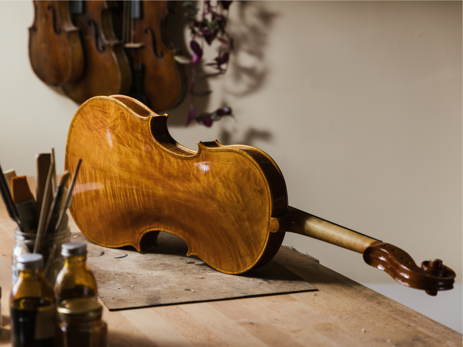 A violin on a workbench at Hardy Violins.