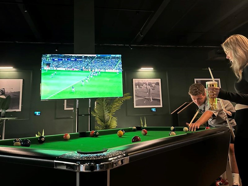 People playing pool at Clubhouse.