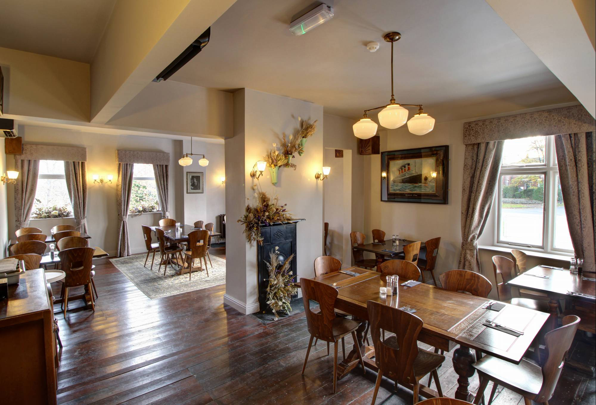 The interior of The Horse & Jockey with wooden floors and a bright and welcoming atmosphere.