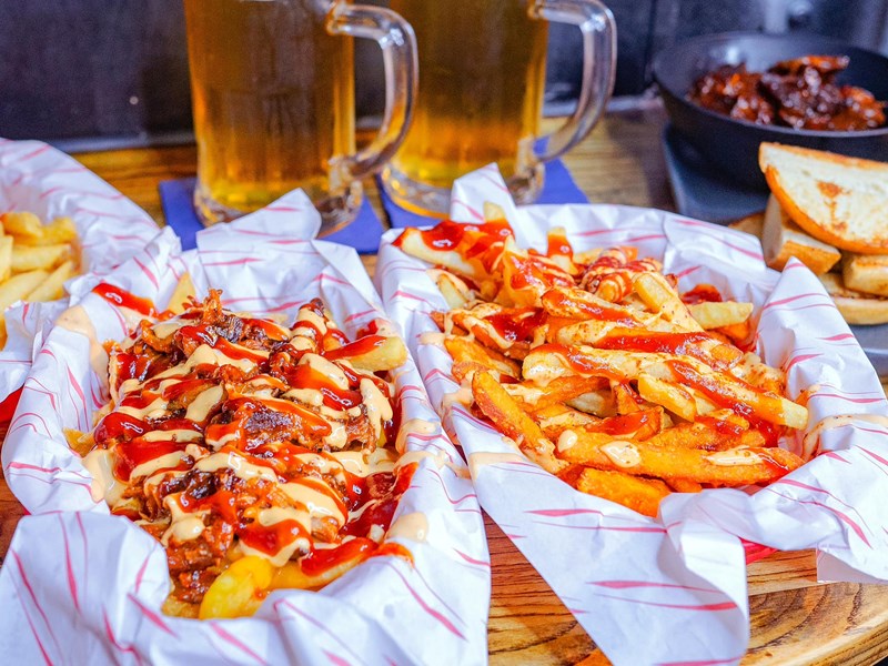 Beer and dirty fries at FirePit Rocks Bar and BBQ.