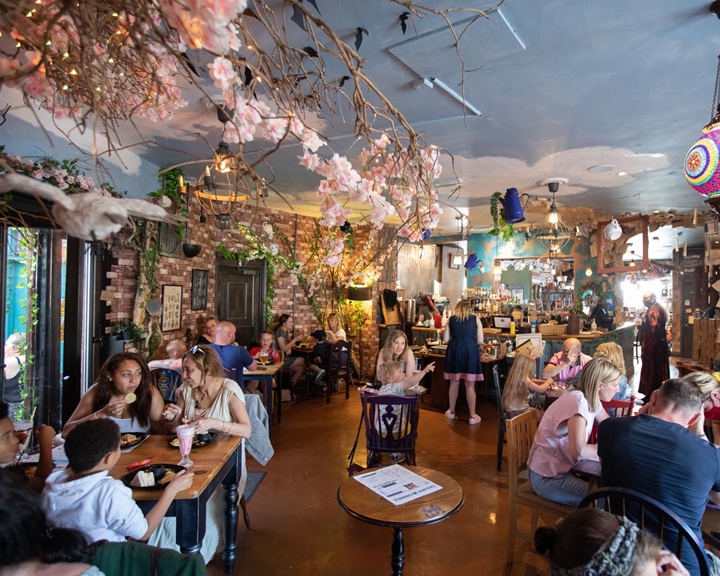 Interior of The Steel Cauldron. All the tables are filled with people eating and drinking.