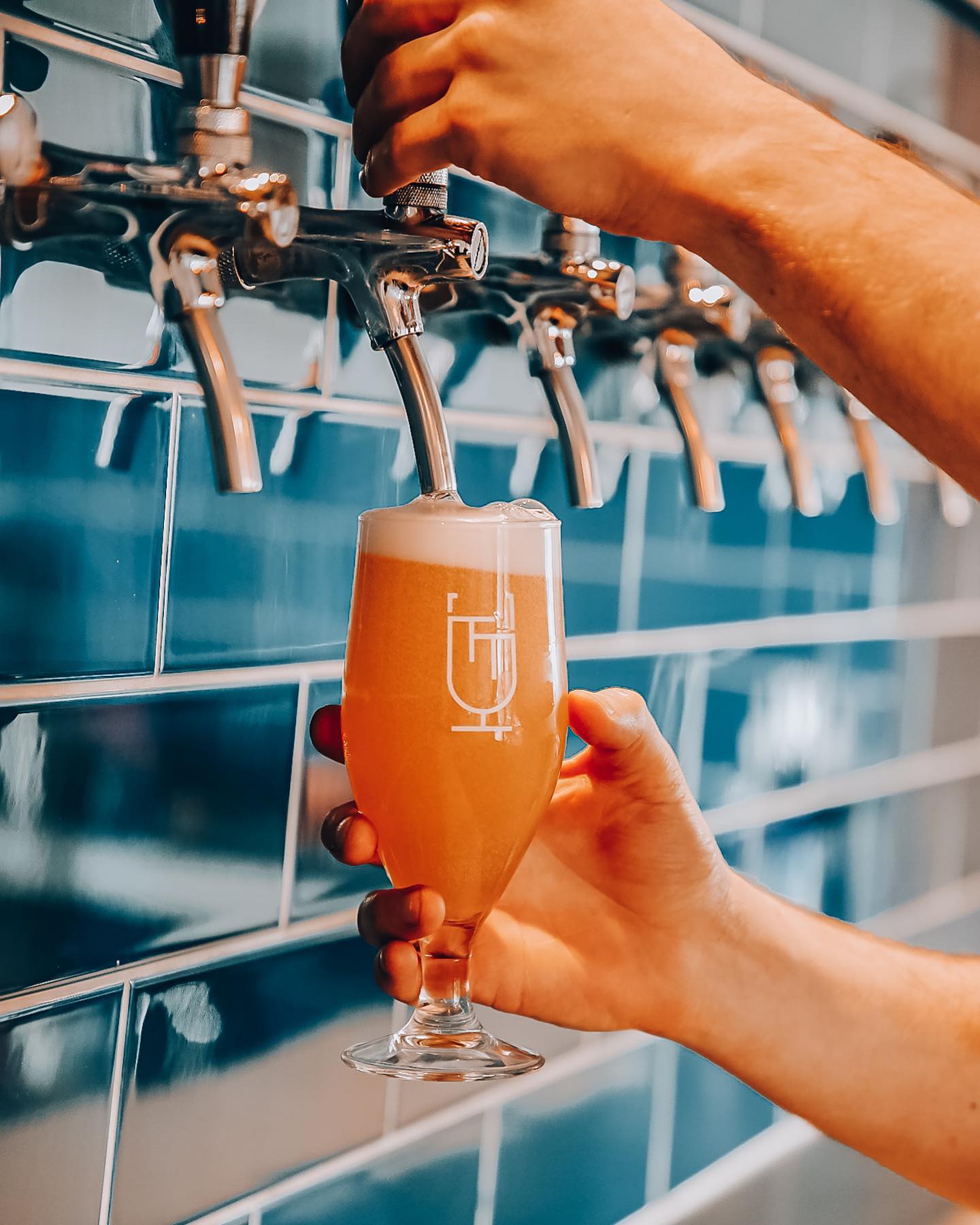 A glass of beer being poured at the Two Thirds Beer Co.