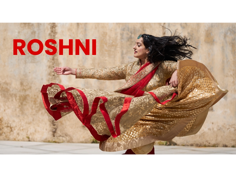 A woman, in Persian clothing, dances. Overlaid on the image is the word 'Roshni' in red text.