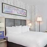 Bedroom featuring one double bed with modern furnishings.