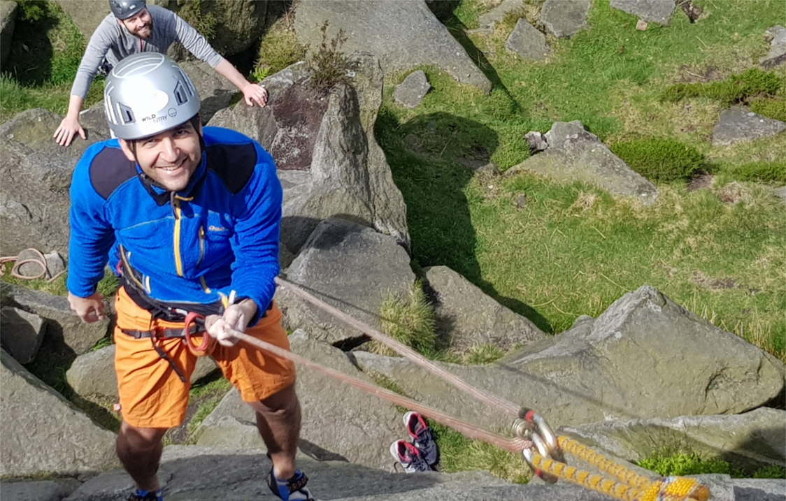 A person learning rock climbing.