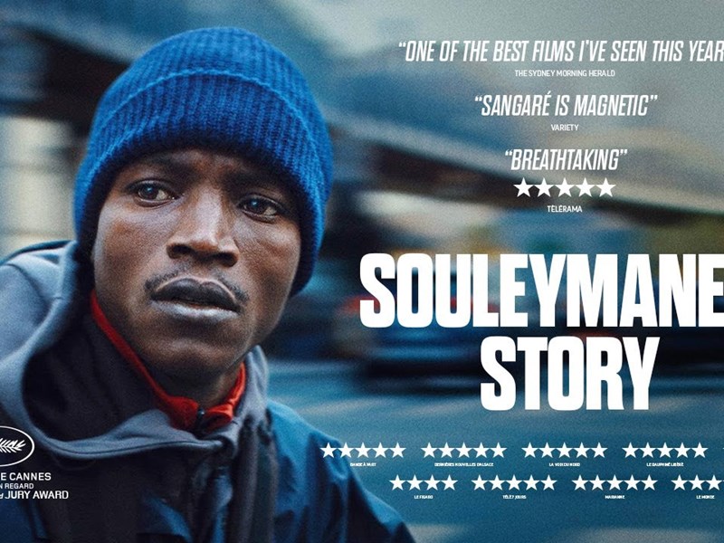Movie poster for "Souleymane's Story" showing a close-up of a person in a blue beanie and jacket against a blurred urban backdrop. The poster features critical acclaim with quotes from The Sydney Morning Herald, Variety, and Télérama, star ratings, and mentions of Festival de Cannes awards for Best Actor and Jury Prize.