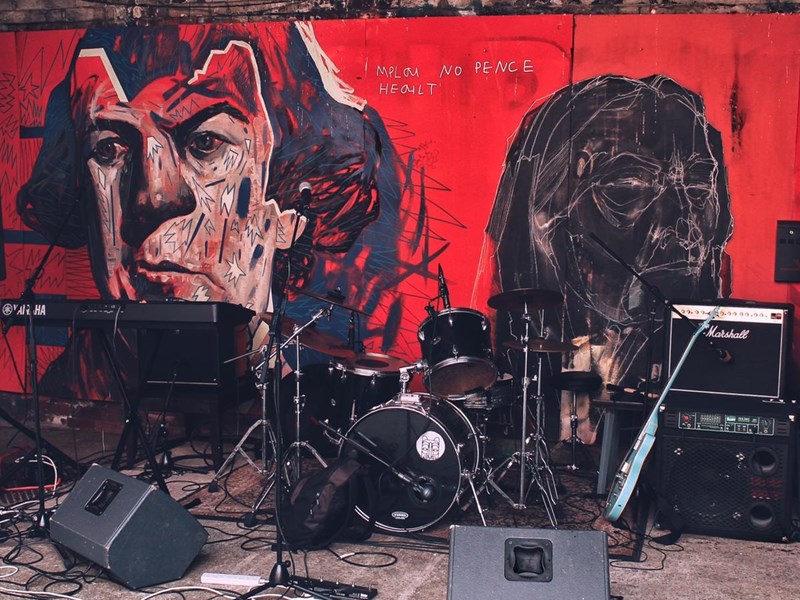 A small stage full of musical equipment, ready for a gig.