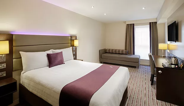 Premier Inn Sheffield Arena – double room with signature purple decor.