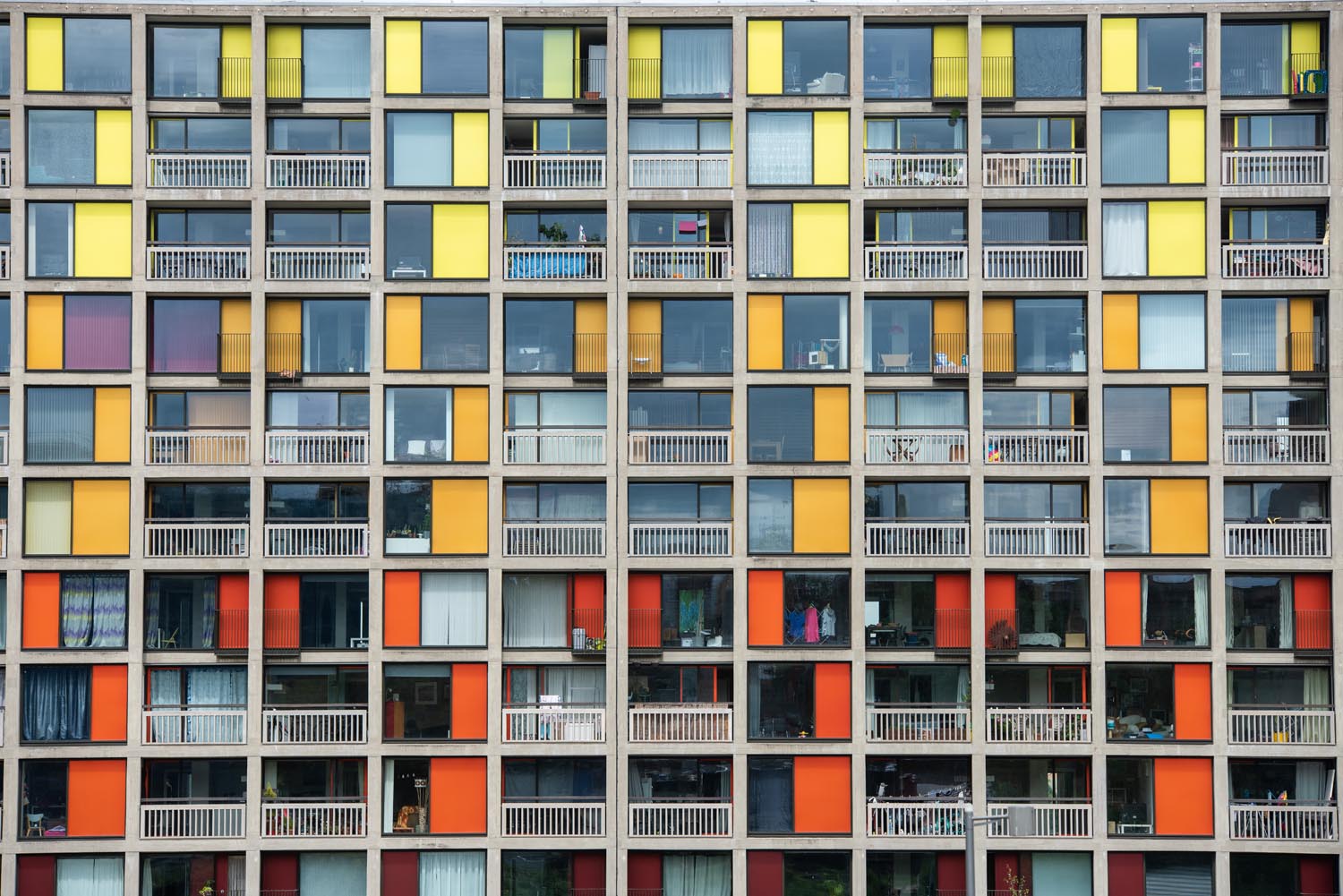 A detail of the refurbished Park Hill Flats with colourful yellow, orange and red panels.
